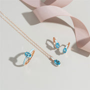 Anello in smalto blu Siberian Waltz e topazio blu ovale in oro rosa vermeil