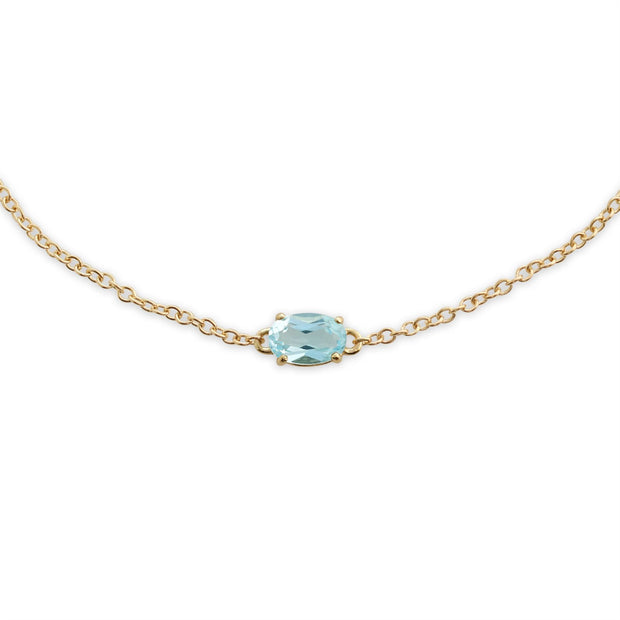 Classico bracciale e orecchini pendenti in oro giallo 375 con topazio azzurro ovale